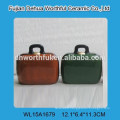 Lovely ceramic saving money bank in suitcase shape